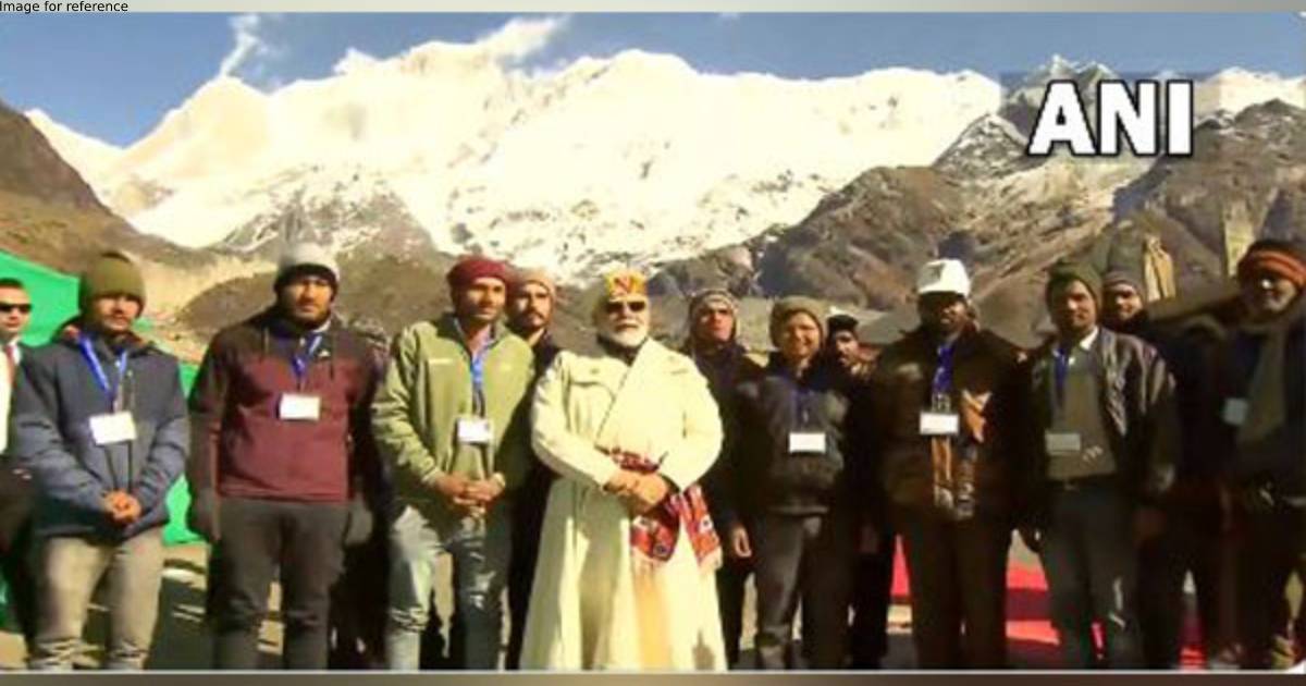 PM Modi interacts with workers engaged in development projects at Kedarnath